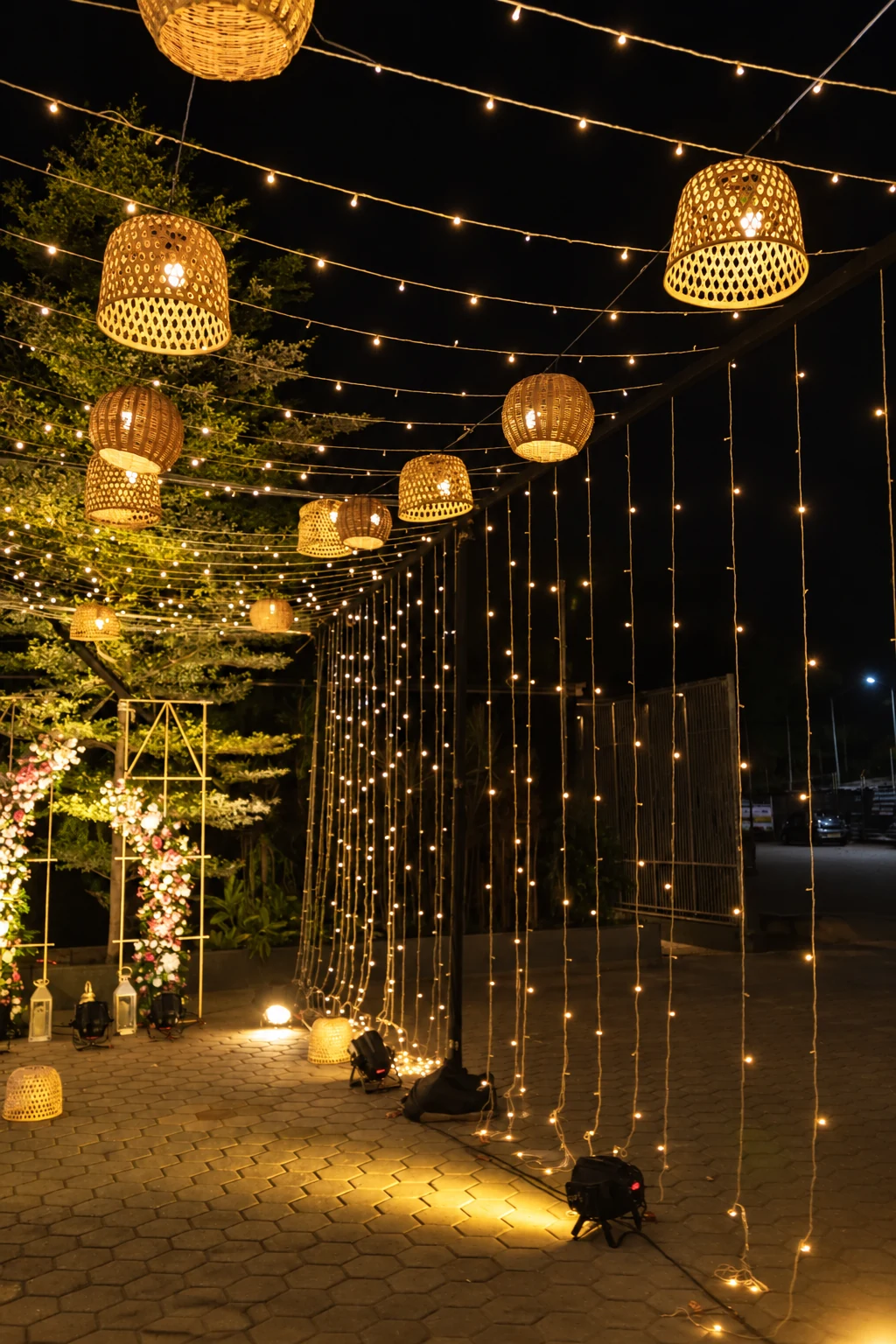 Warm hanging lanterns illuminating an outdoor celebration